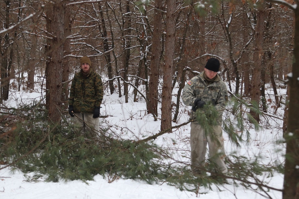 Cold-Weather Operations Course Class 20-02 students conduct field ops, improvised shelter construction