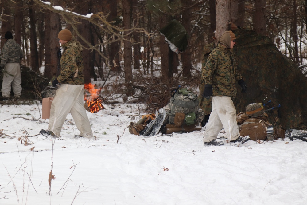 Cold-Weather Operations Course Class 20-02 students conduct field ops, improvised shelter construction