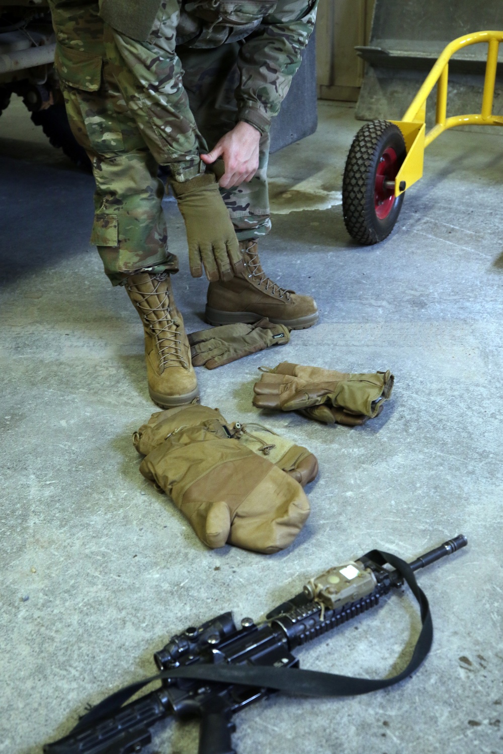 Soldier dons Prototype Cold Weather Glove System