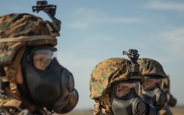 Marines test shooting capabilities with M-50 field protective mask