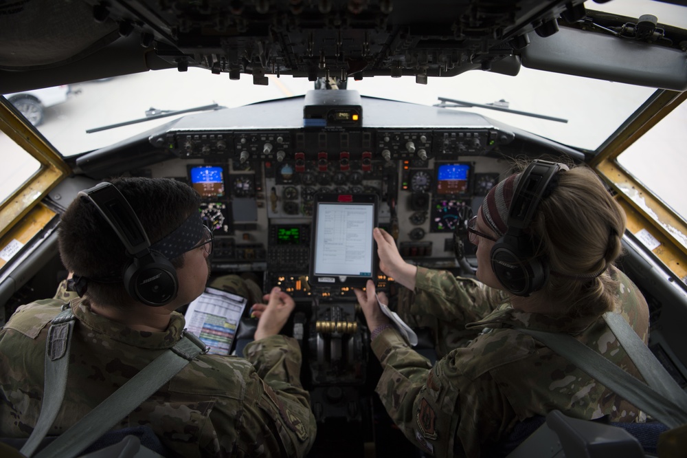 A U.S. Air Force KC-135 aircrew assigned to the 28th Expeditionary Air Refueling Squadron conducts aerial refueling