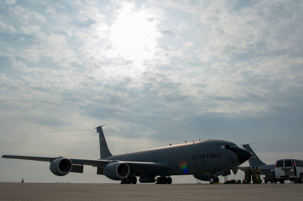 A U.S. Air Force KC-135 aircrew assigned to the 28th Expeditionary Air Refueling Squadron conducts aerial refueling