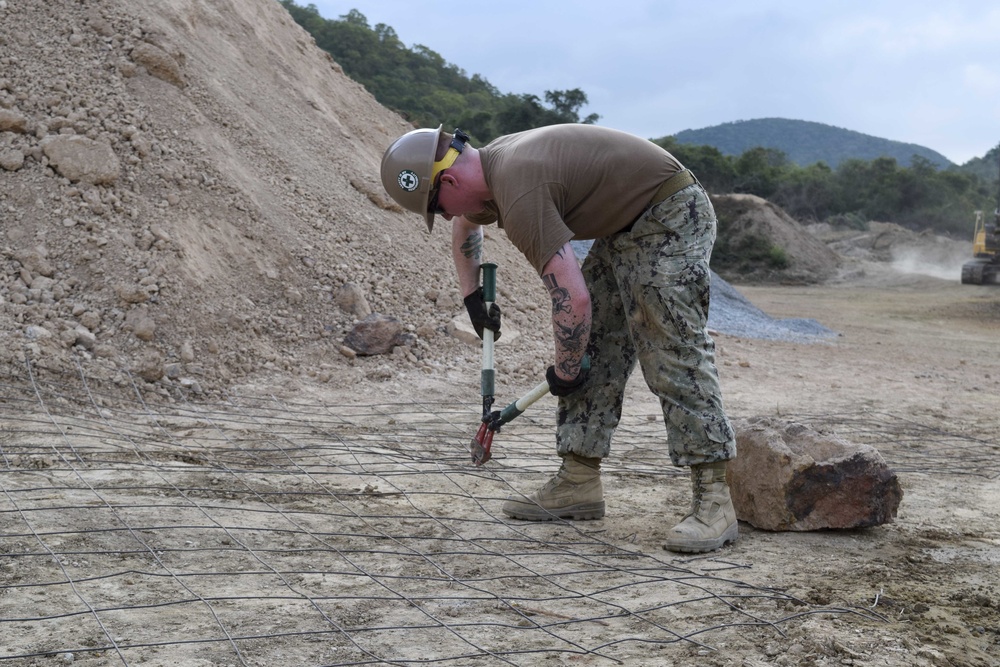 U.S. Navy Seabees with NMCB-5’s Detail Thailand work on a joint project with Marines from 9th Engineer Support Battalion and Royal Thai Marine Corps Engineers