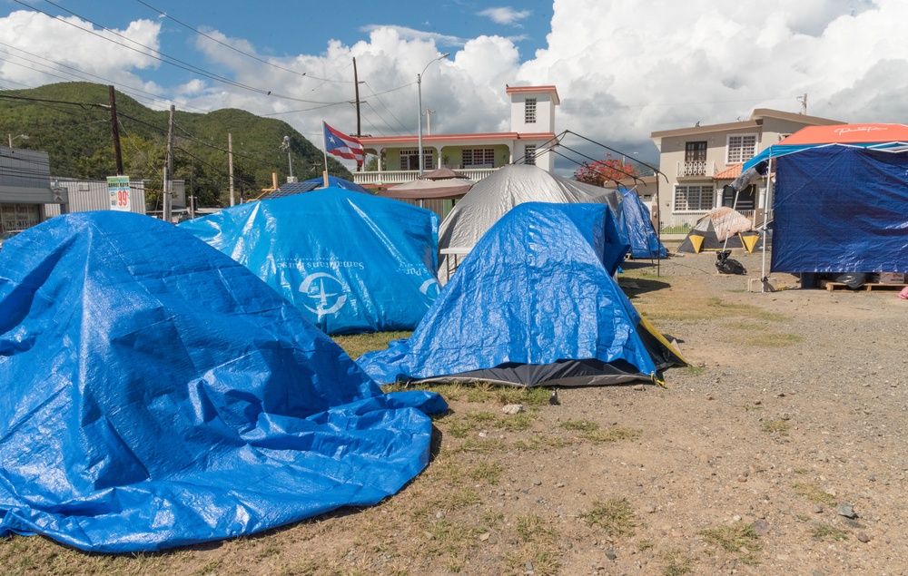 People Sleep in Tents After Quakes