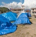 People Sleep in Tents After Quakes