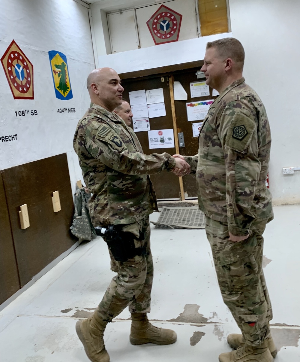 Deployed Illinois Soldiers awarded the Commander’s Coin of Excellence