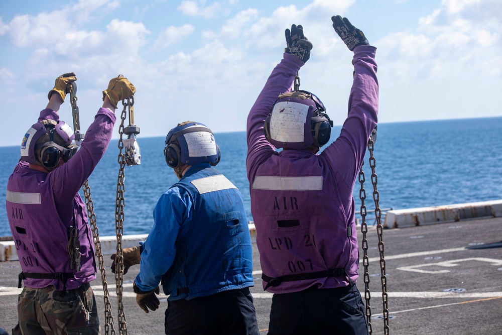 Sailors and Marines take part in flight deck operations