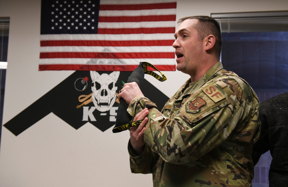 MWD handler gives demonstration to CLIMB High tour