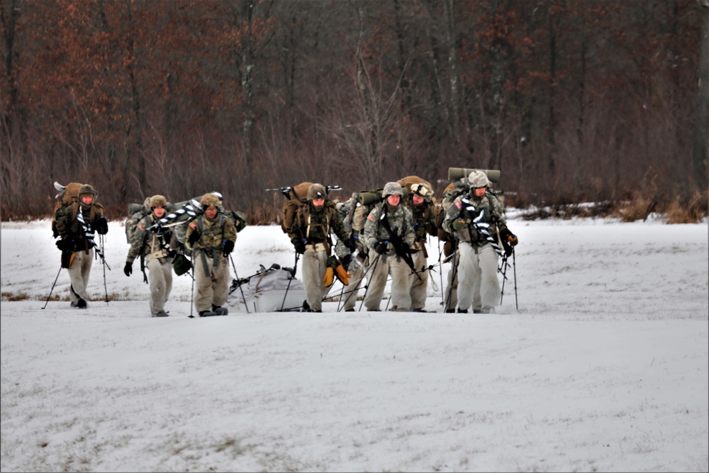 Fort McCoy Cold-Weather Operations Course students practice snowshoeing, ahkio sled use
