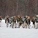 Fort McCoy Cold-Weather Operations Course students practice snowshoeing, ahkio sled use