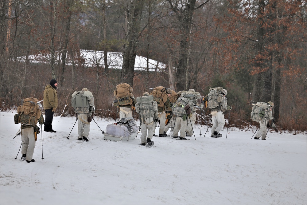 Fort McCoy Cold-Weather Operations Course students practice snowshoeing, ahkio sled use