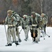 Fort McCoy Cold-Weather Operations Course students practice snowshoeing, ahkio sled use