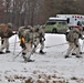 Fort McCoy Cold-Weather Operations Course students practice snowshoeing, ahkio sled use