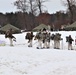 Fort McCoy Cold-Weather Operations Course students practice snowshoeing, ahkio sled use