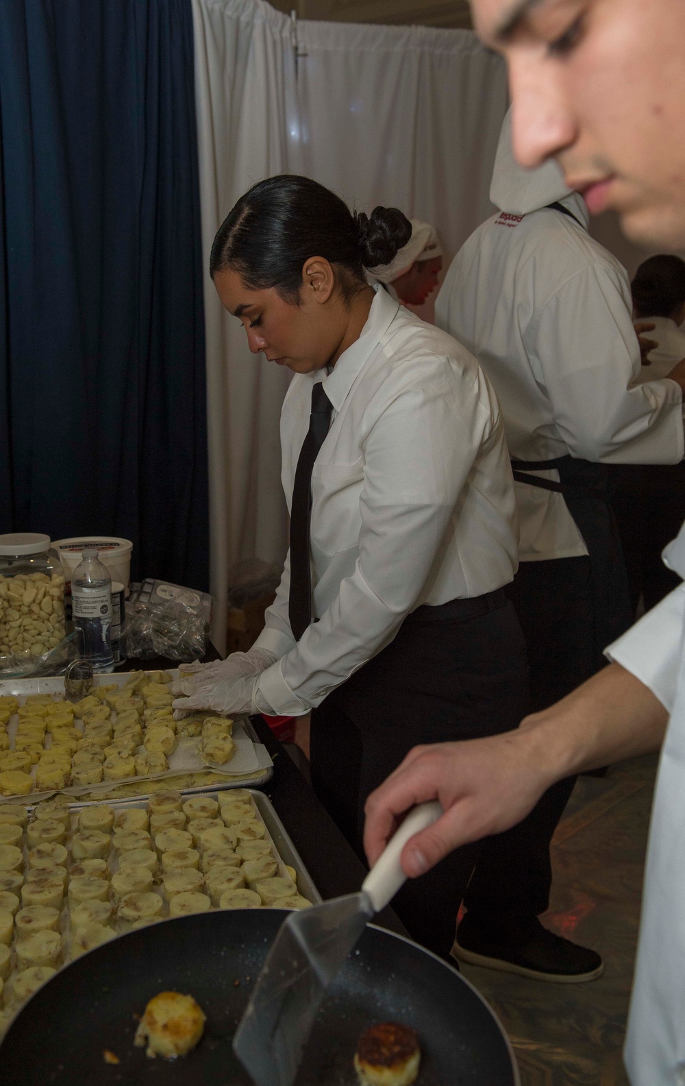 GHWB Sailor Prepares Potatoes