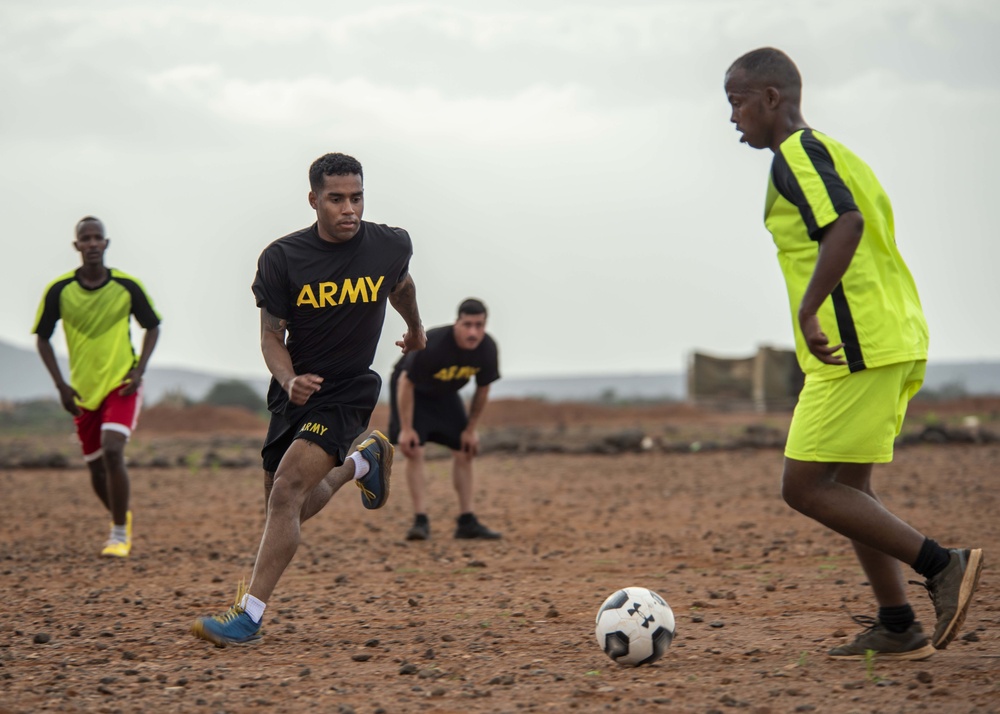 Combined Joint Task Force – Horn of Africa and Djiboutian Army Rapid Intervention Battalion service members participate in friendly soccer match