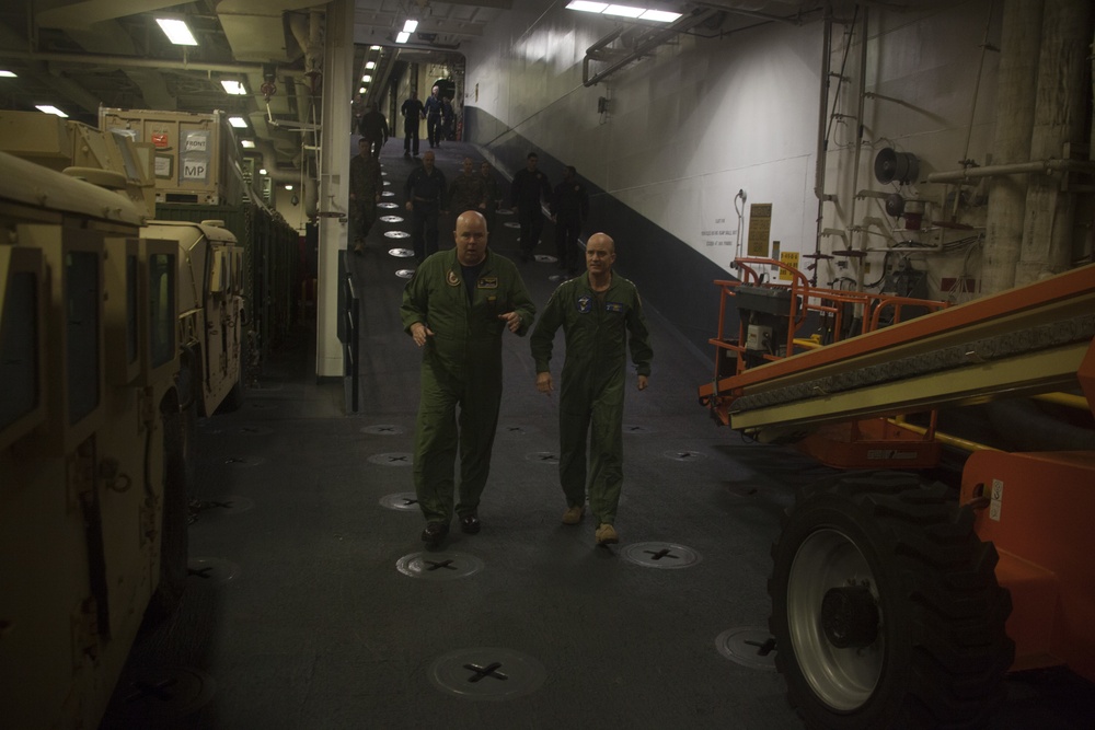 31st MEU Marines and Sailors aboard the USS America (LHA 6) welcome Vice Adm. William R. Merz