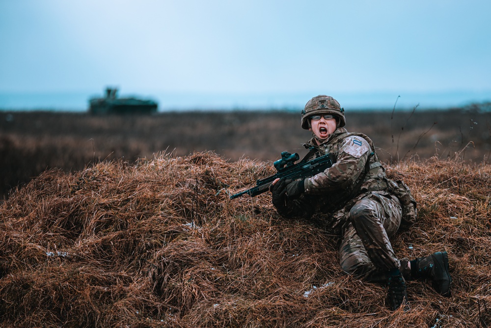 British Soldiers complete section live fire training during eFP