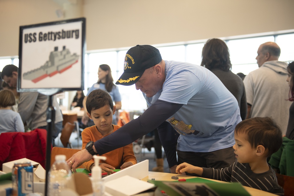 U.S. Navy Sailors volunteer for LEGO Brick by Brick Shipbuilding Event