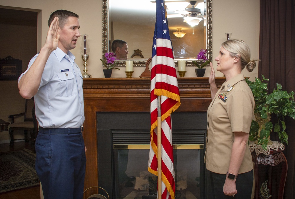 NC1 Melanie Mancuso reenlists at her family home