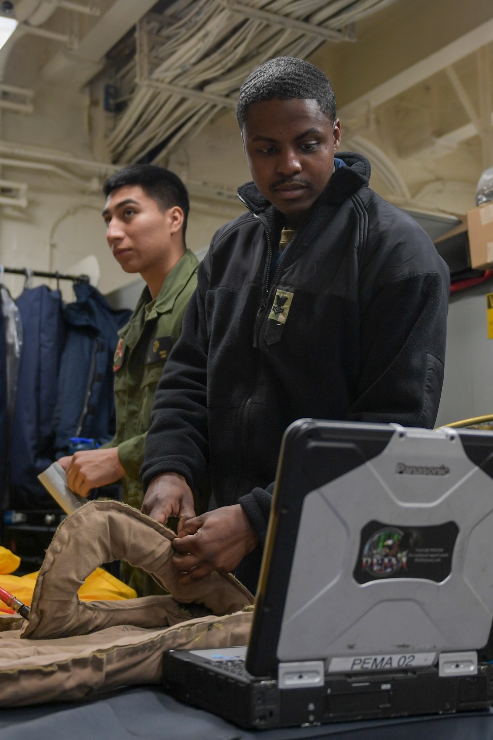 Sailors, Marines Conduct Life Preserver Maintenance