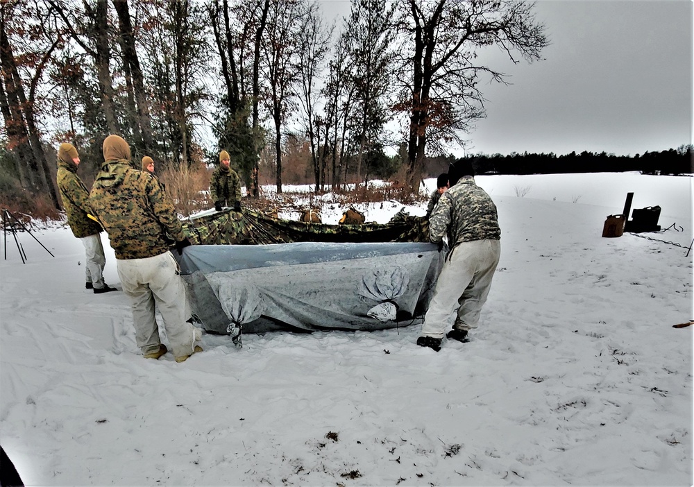 Cold-Weather Operations Course students practice use of Arctic 10-person tent at Fort McCoy