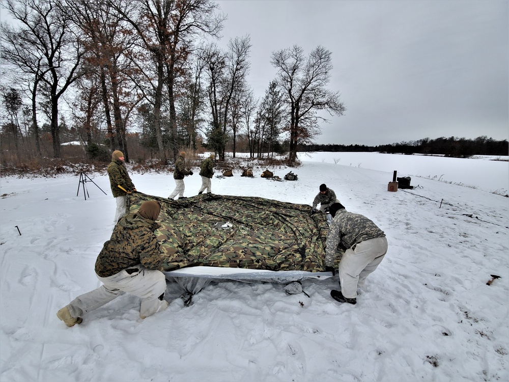 Cold-Weather Operations Course students practice use of Arctic 10-person tent at Fort McCoy