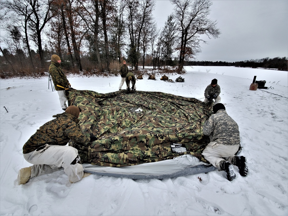 Cold-Weather Operations Course students practice use of Arctic 10-person tent at Fort McCoy