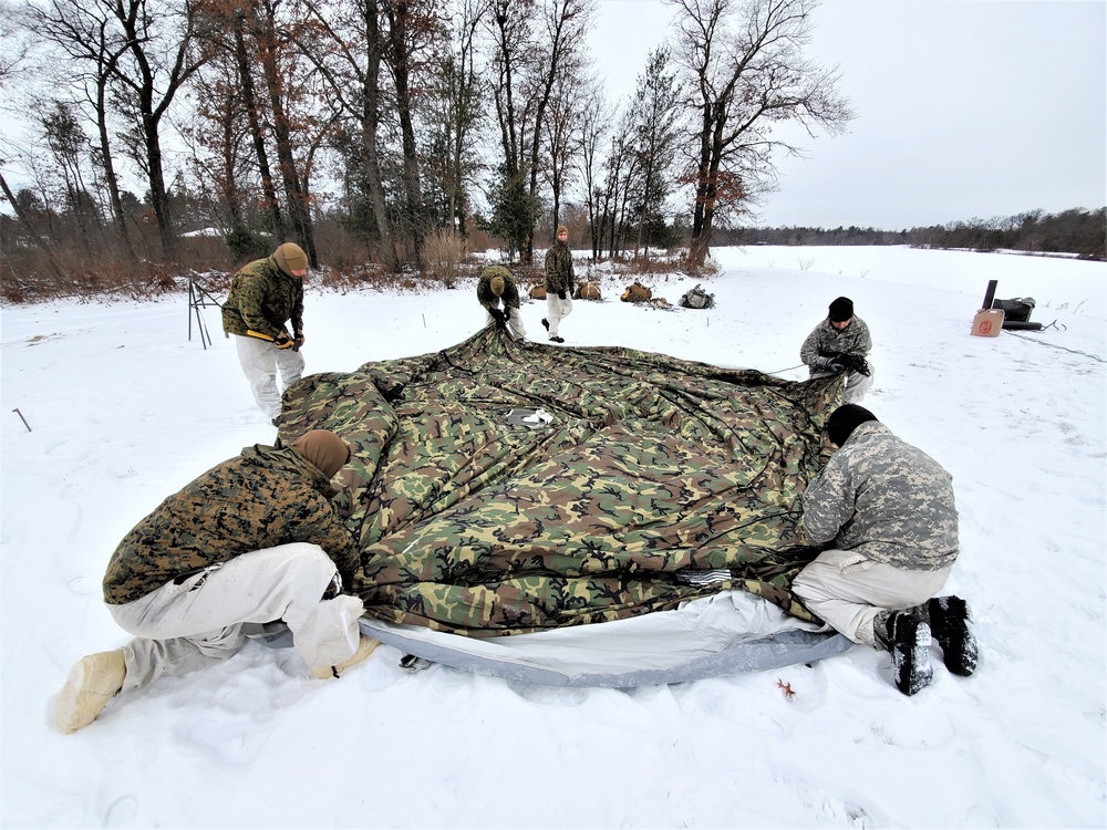 Cold-Weather Operations Course students practice use of Arctic 10-person tent at Fort McCoy