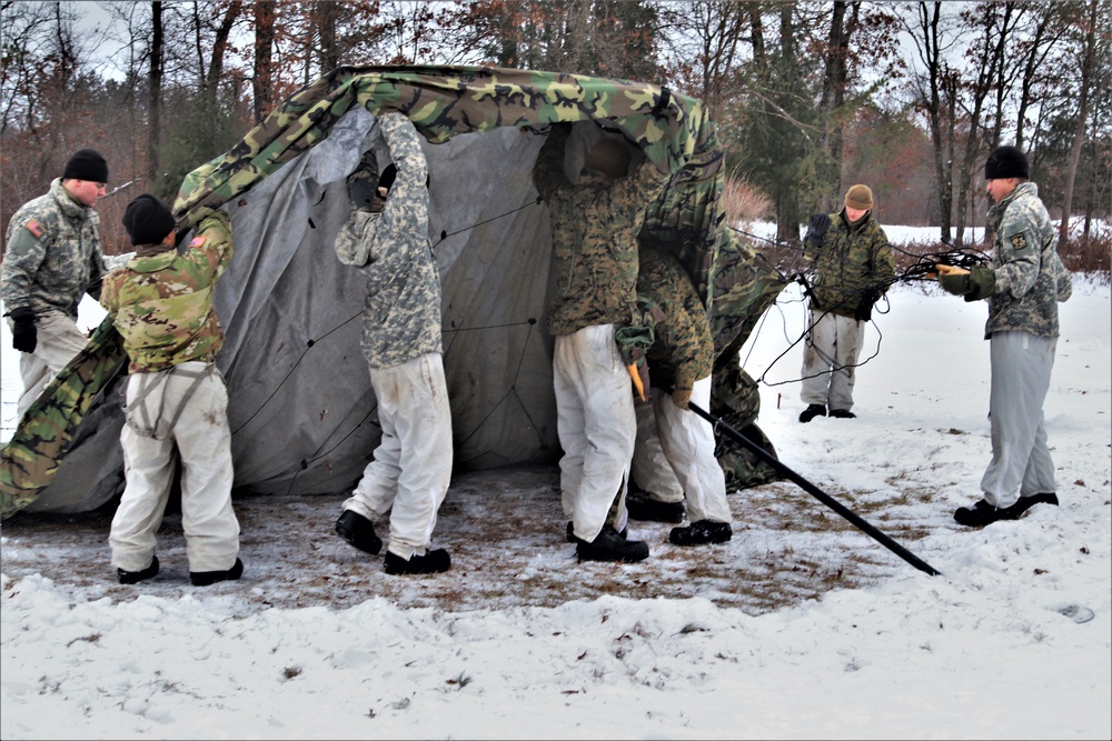 Cold-Weather Operations Course students practice use of Arctic 10-person tent at Fort McCoy