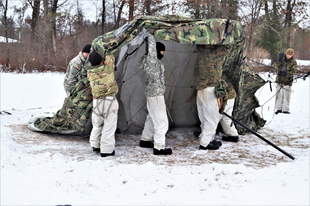 Cold-Weather Operations Course students practice use of Arctic 10-person tent at Fort McCoy