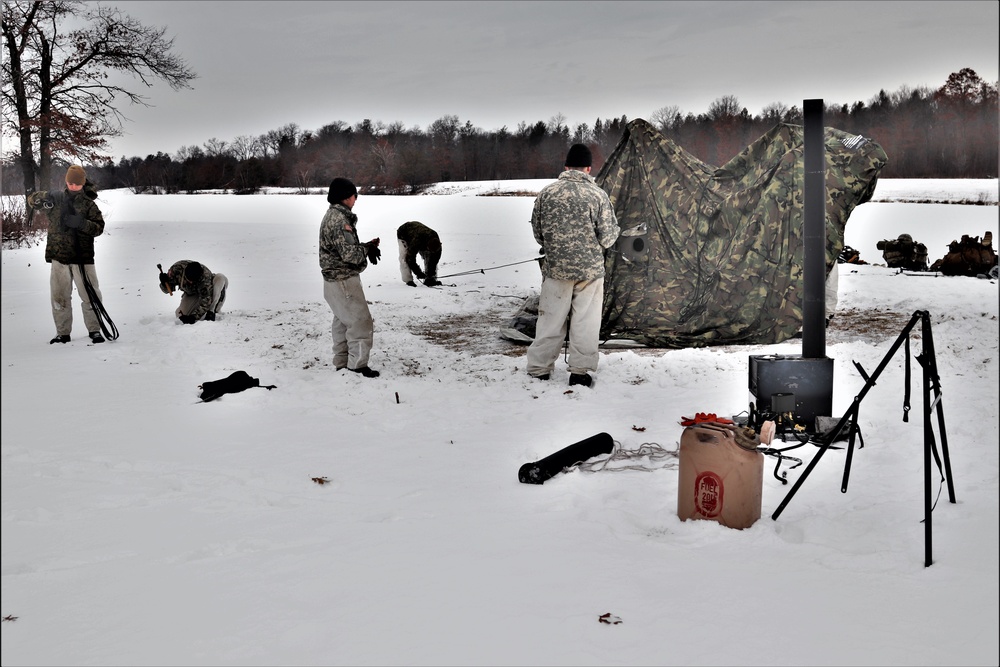 Cold-Weather Operations Course students practice use of Arctic 10-person tent at Fort McCoy