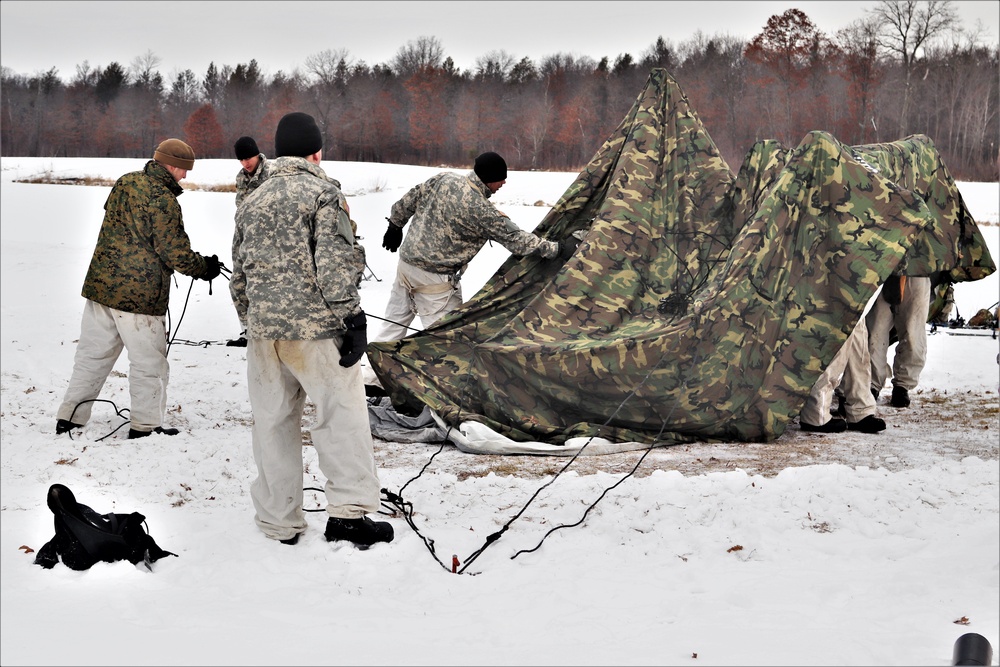 Cold-Weather Operations Course students practice use of Arctic 10-person tent at Fort McCoy