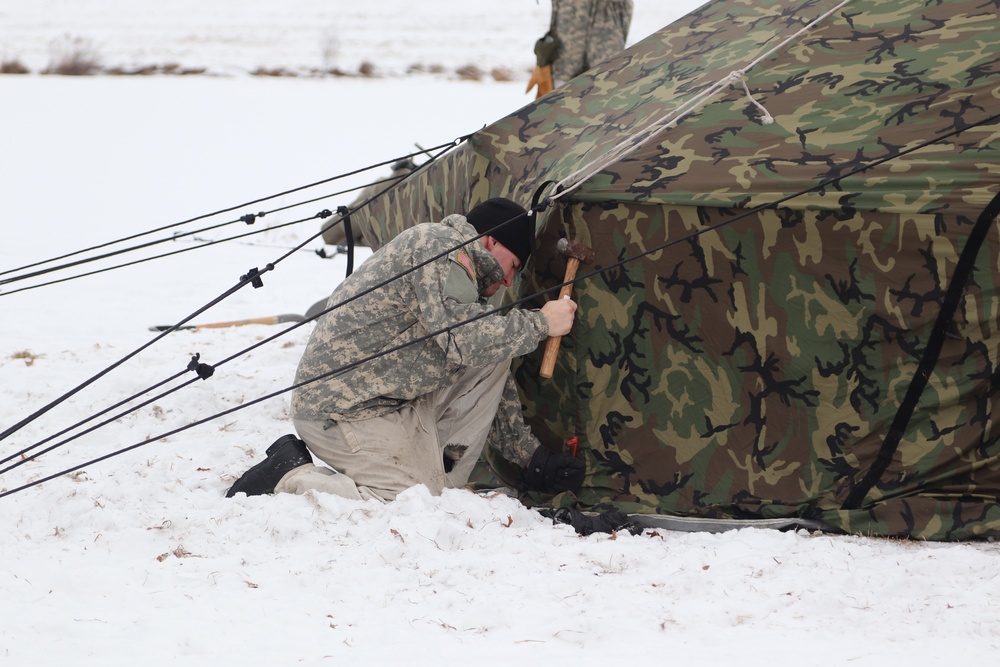 Cold-Weather Operations Course students practice use of Arctic 10-person tent at Fort McCoy