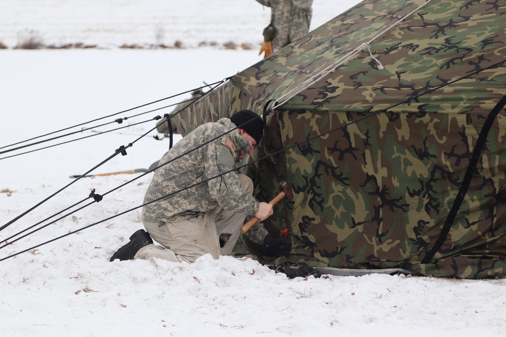 Cold-Weather Operations Course students practice use of Arctic 10-person tent at Fort McCoy