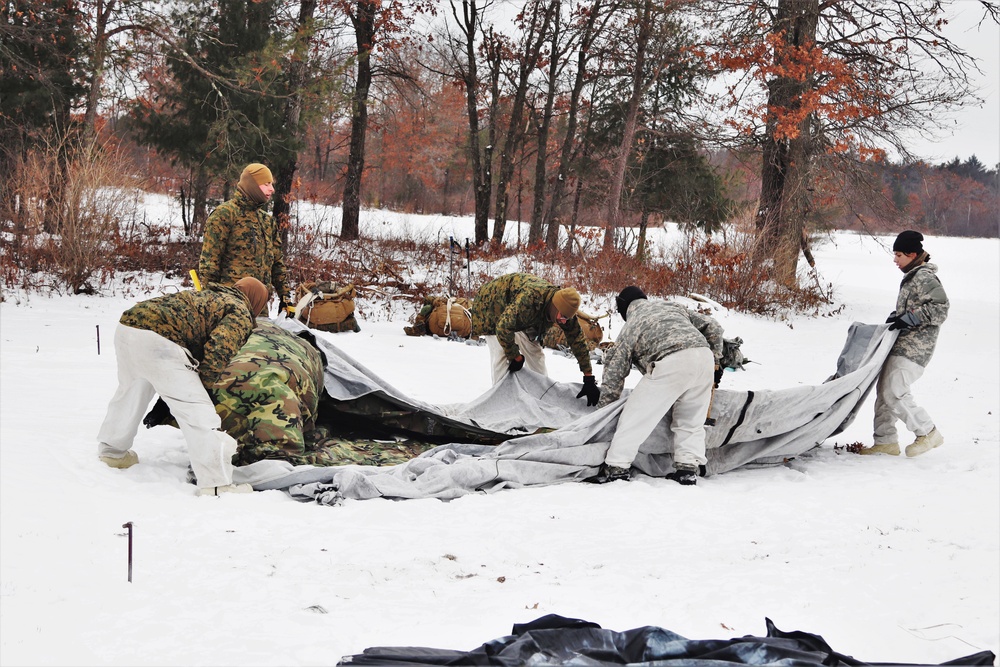 Cold-Weather Operations Course students practice use of Arctic 10-person tent at Fort McCoy