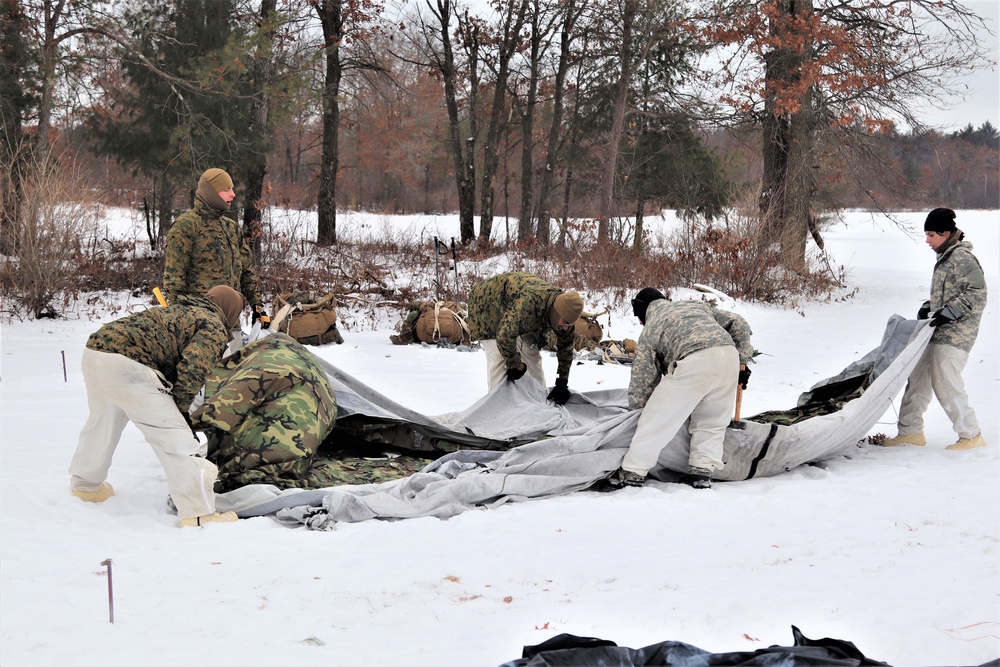 Cold-Weather Operations Course students practice use of Arctic 10-person tent at Fort McCoy