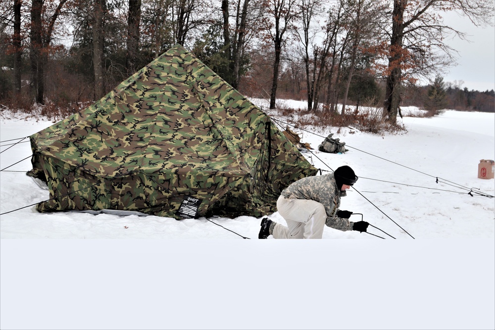 Cold-Weather Operations Course students practice use of Arctic 10-person tent at Fort McCoy