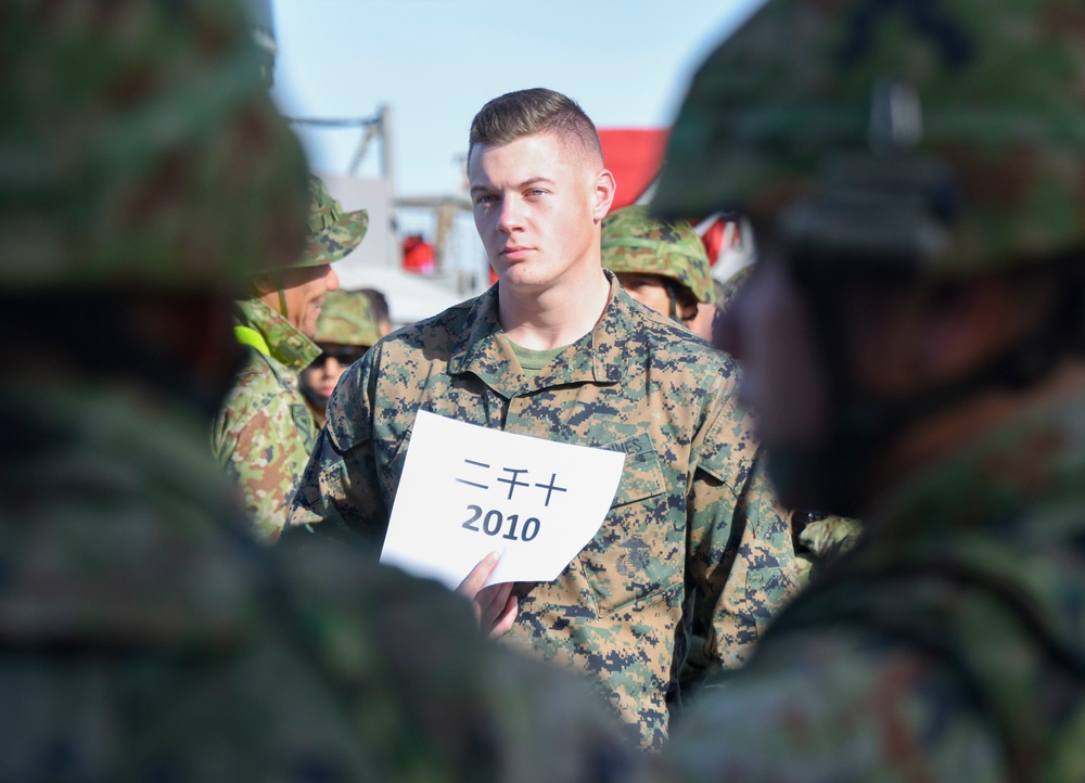 Marine Assembles Japanese Soldiers Aboard USS Pearl Harbor