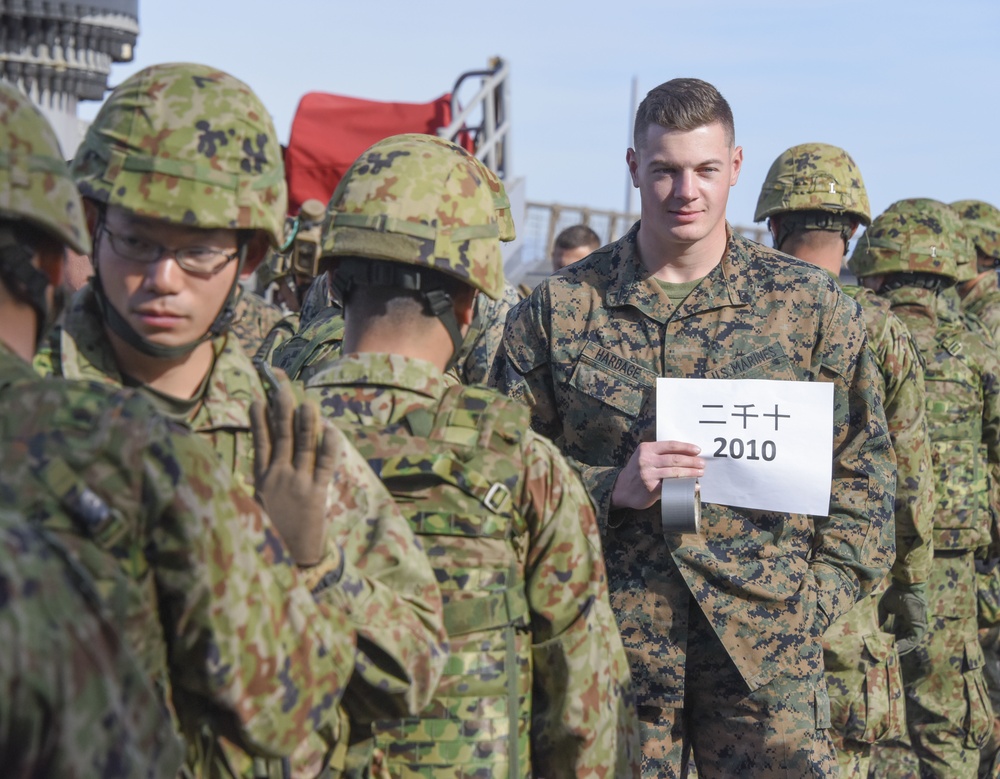 Marine Assembles Japanese Soldiers Aboard USS Pearl Harbor