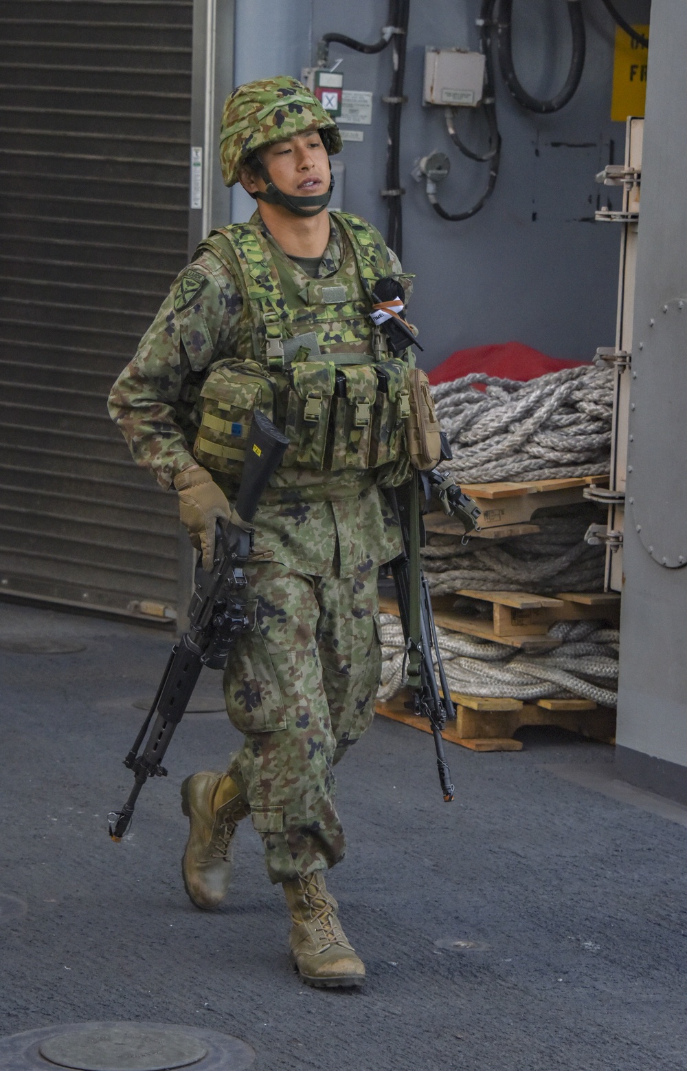 Japanese Soldier Prepares Weapons Aboard USS Pearl Harbor