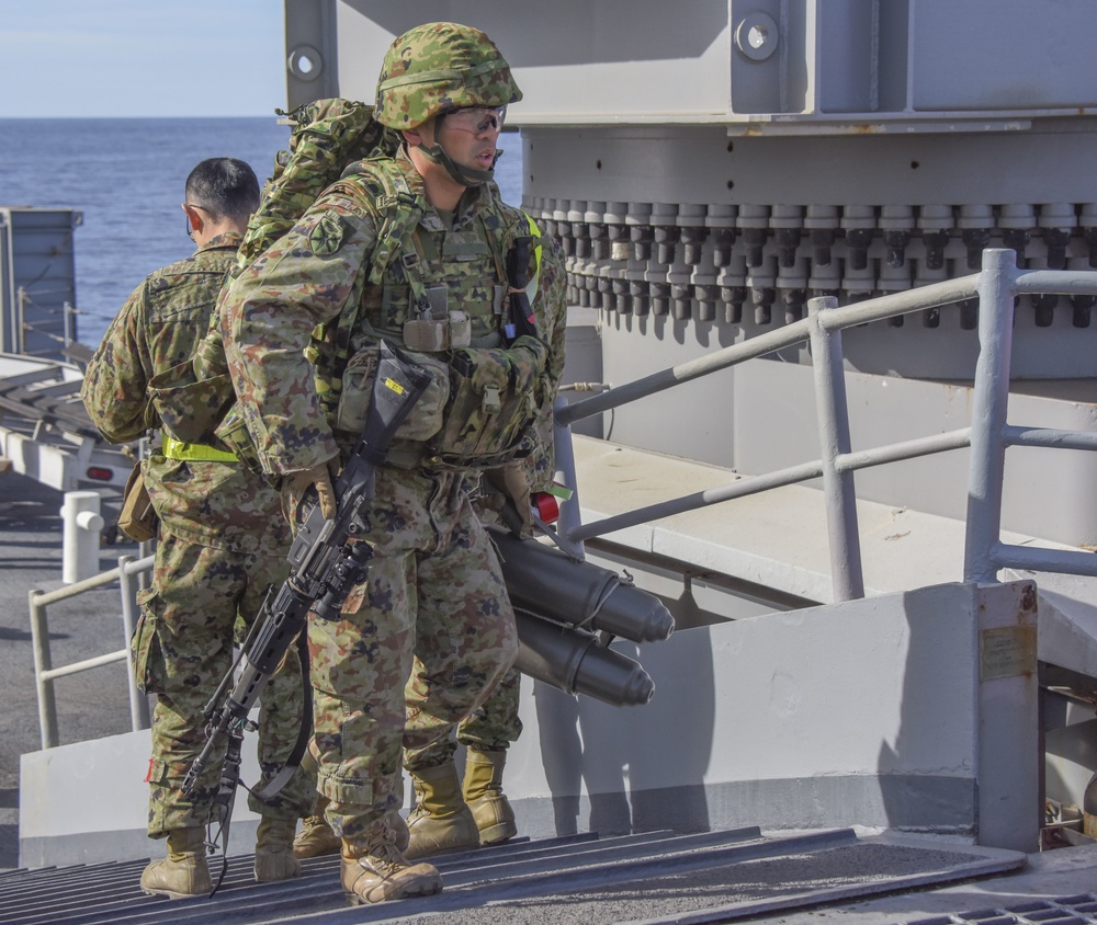 Japanese Soldier Prepares Weapons Aboard USS Pearl Harbor