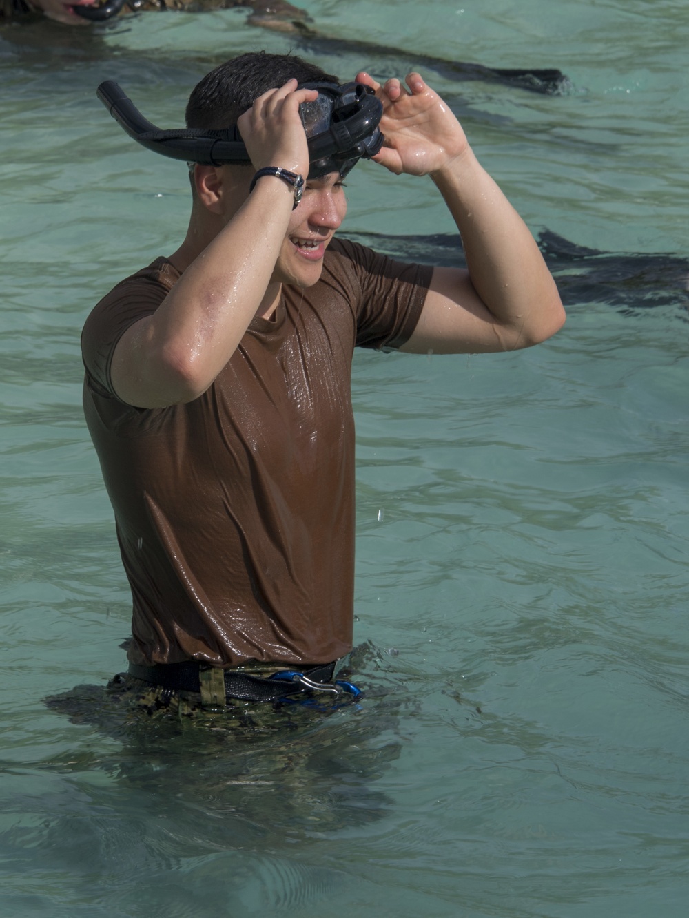 Sailors from NSF Diego Garcia and Royal Marines participate in a British Forces Swim Qualification Test