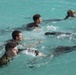 Sailors from NSF Diego Garcia and Royal Marines participate in a British Forces Swim Qualification Test