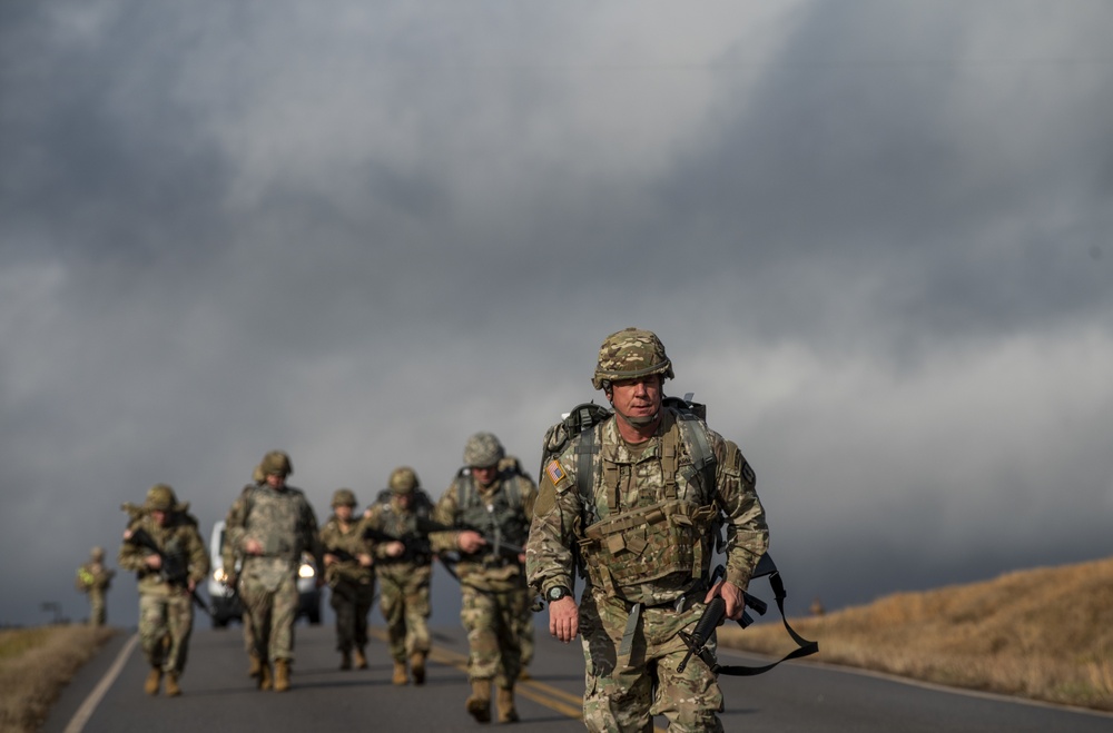 Warrant officer candidates ruck march for course requirement