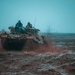 Polish and Romanian Soldiers work together to accomplish training tasks during eFP