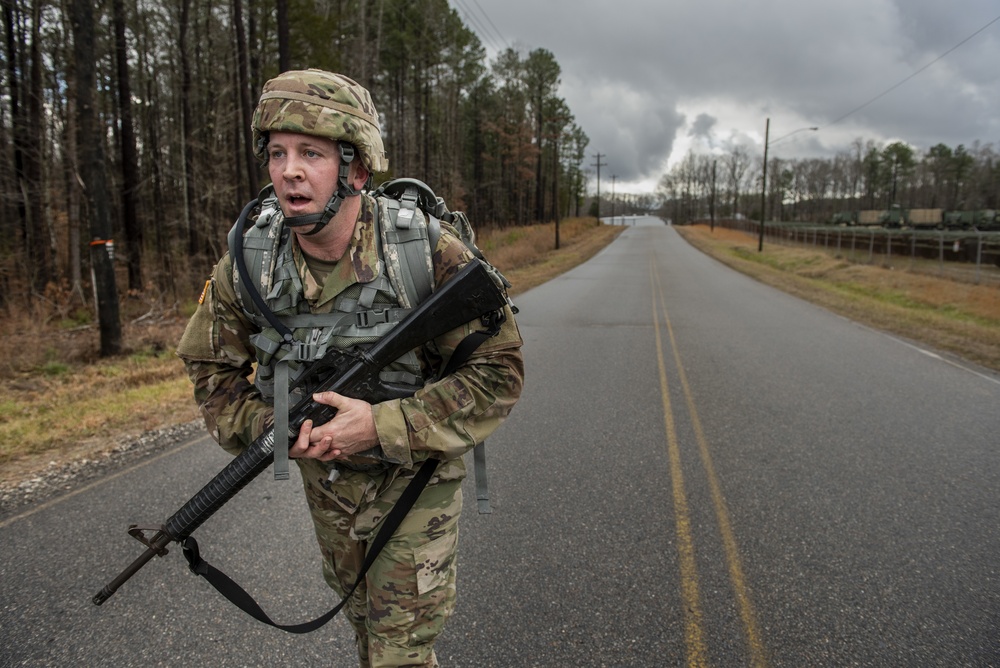 Warrant officer candidates ruck march for course requirement