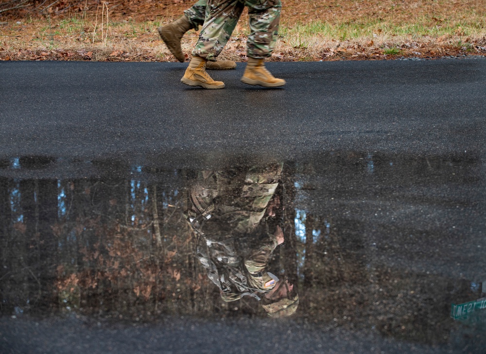 Warrant officer candidates ruck march for course requirement