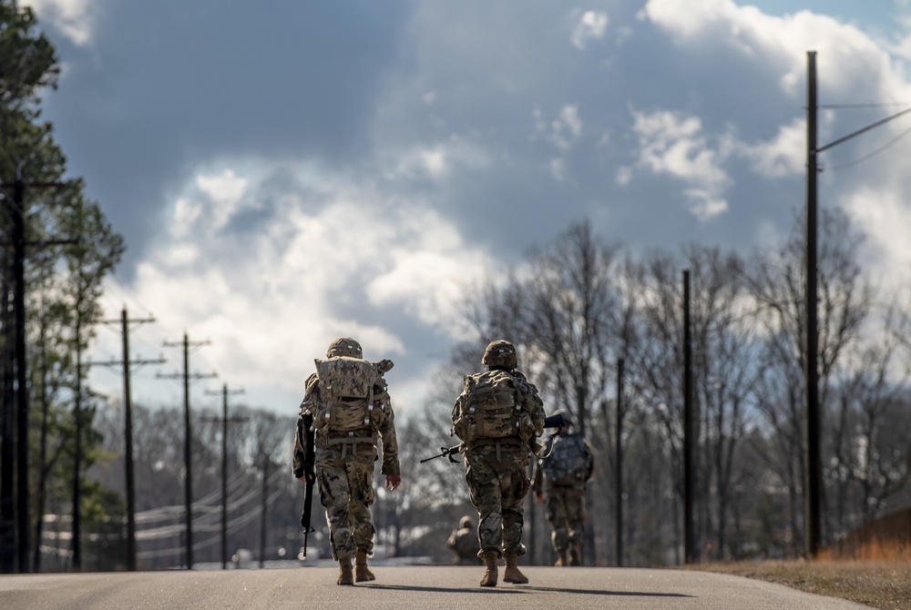 Warrant officer candidates ruck march for course requirement