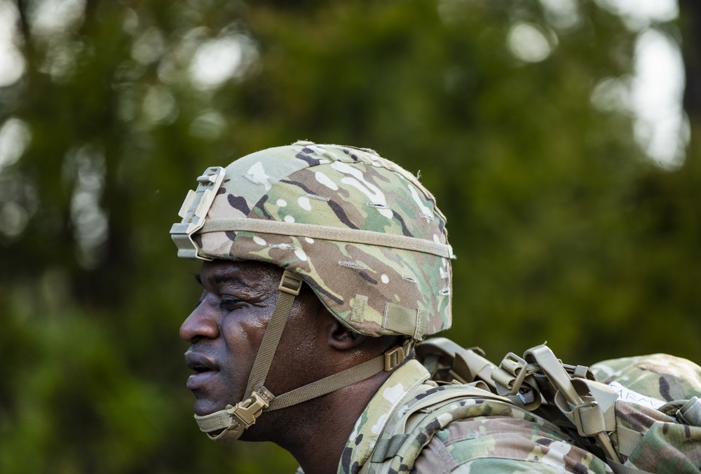 Warrant officer candidates ruck march for course requirement